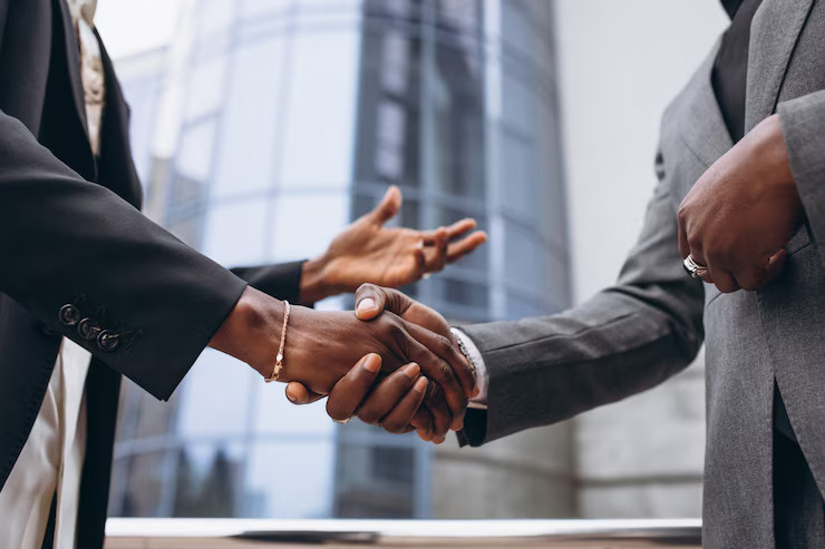 Two black hands shaking together